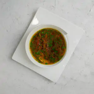 Грибний бульон з тортеліні та овочами